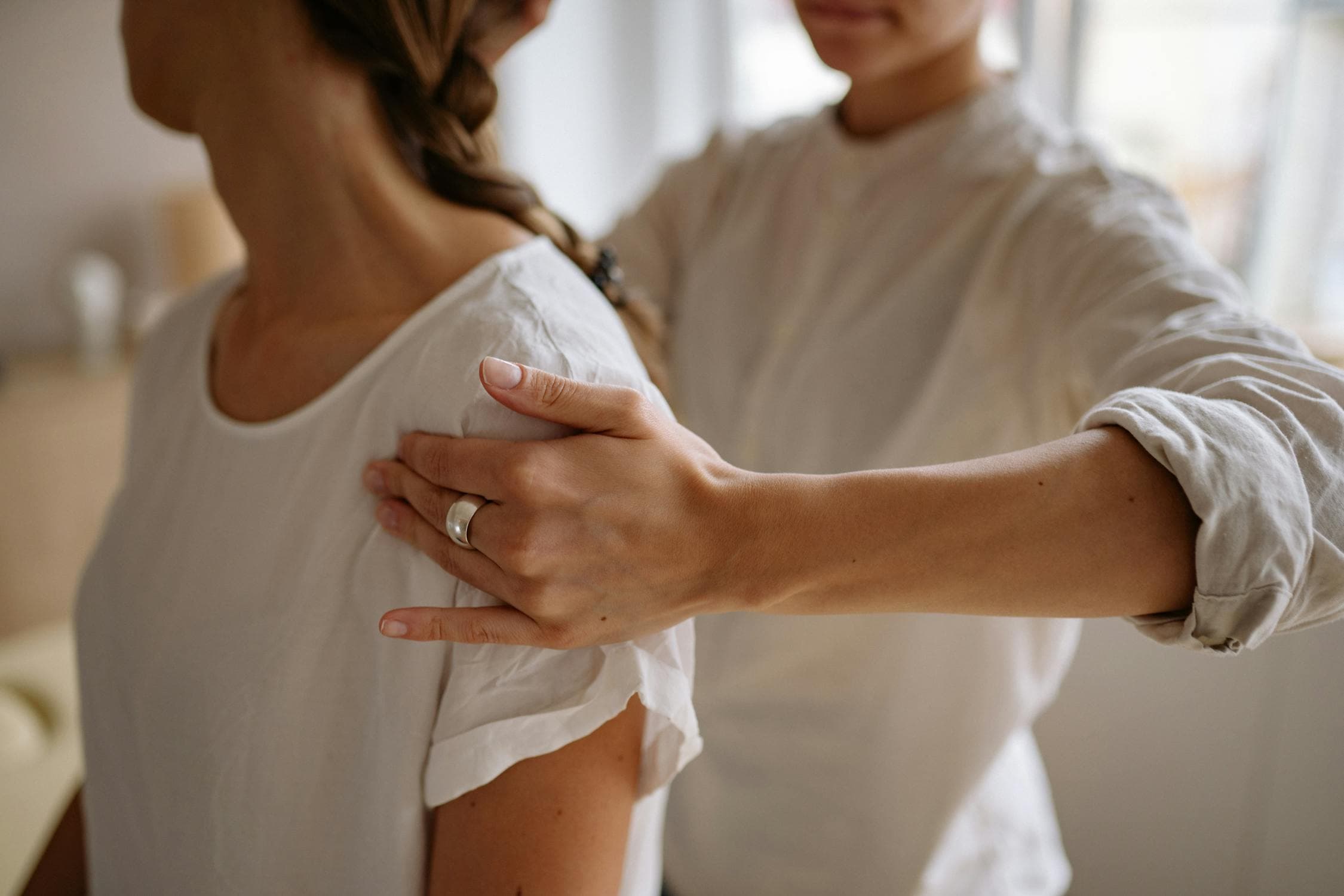 Physical therapist helping a patient during a rehabilitation session